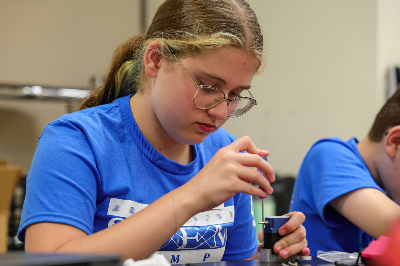 SmartServo STEM Camp student testing a servo-powered build